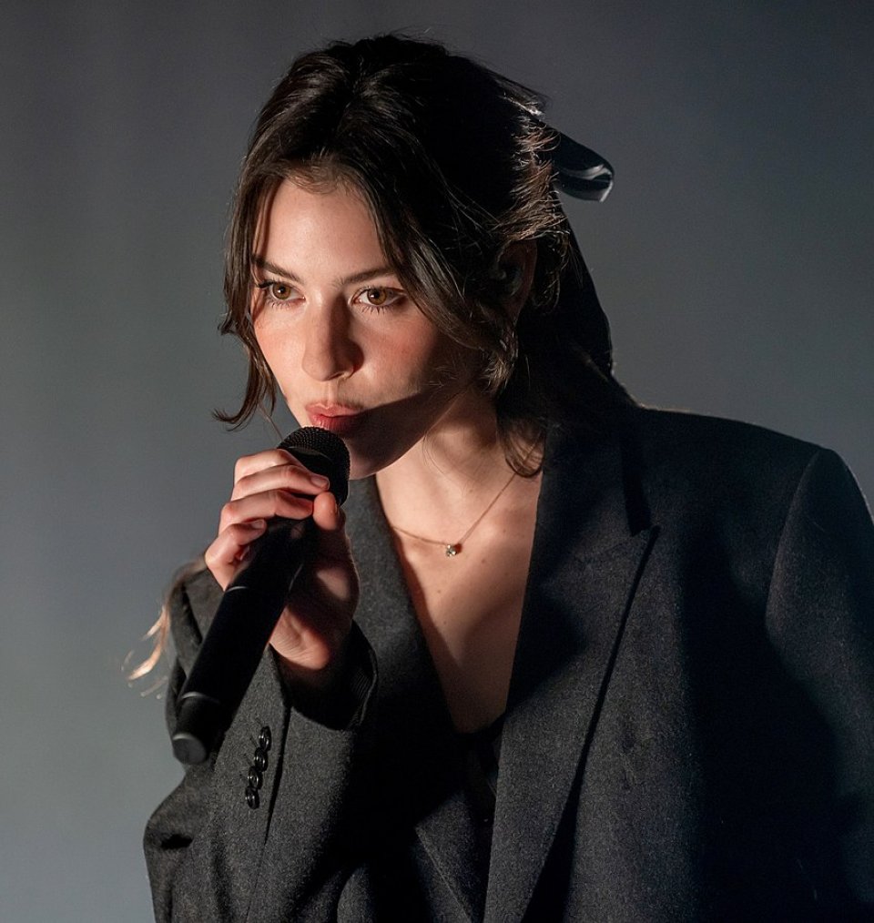 Gracie Abrams performing live on stage